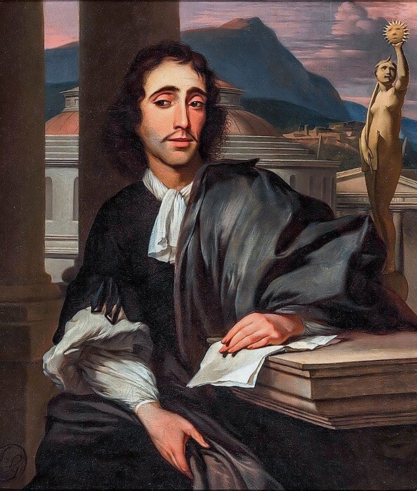 A colour portrait of the sublime philosopher Baruch Spinoza. He is soberly dressed in a flowing black robe and is sitting at a table with papers under his left forearm. A statuette of a female figure holding a solar globe is behind him and, beyond the open portico on which he seems to be sitting, we see the dome of a building, a cityscape, and a distant mountain.
