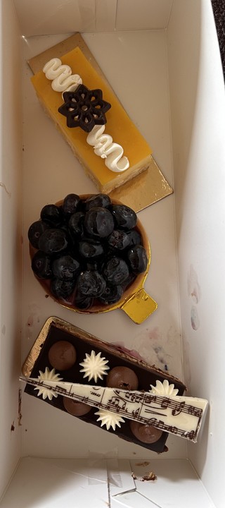 The top one was free with the purchase of the Blueberry Tart and the Viennese Opera cake.

It might be cheesecake
