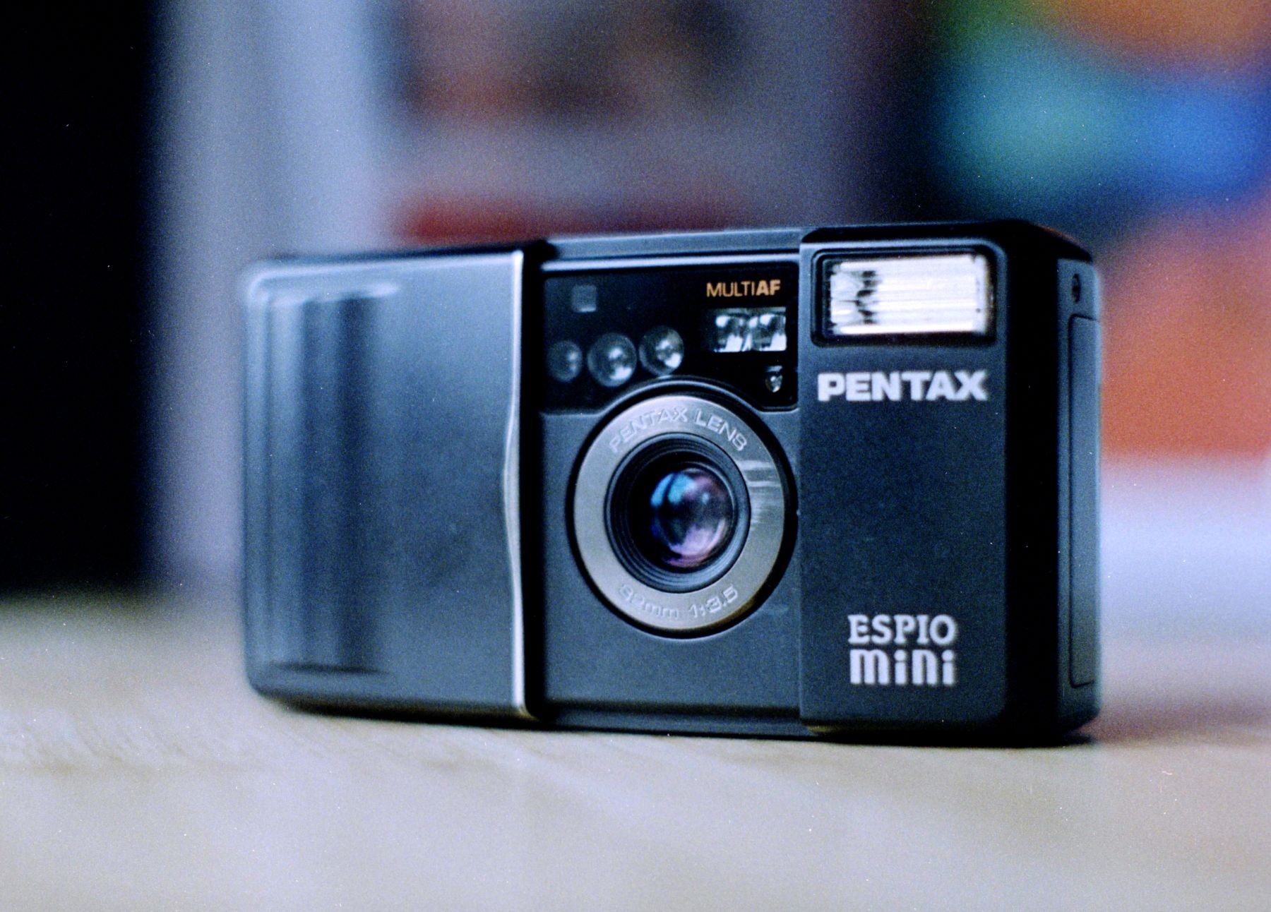 A small black point-and-shoot camera, Pentax Espio Mini