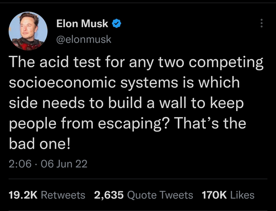 Elon Musk tweet reading: The acid test for any two competing socioeconomic systems is which side needs to build a wall to keep people from escaping? That’s the bad one!