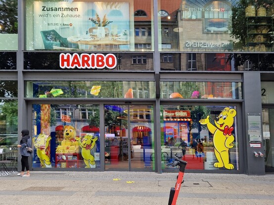 A Haribo shop, with colourful cartoon bears on the front window, and an animated display above the door