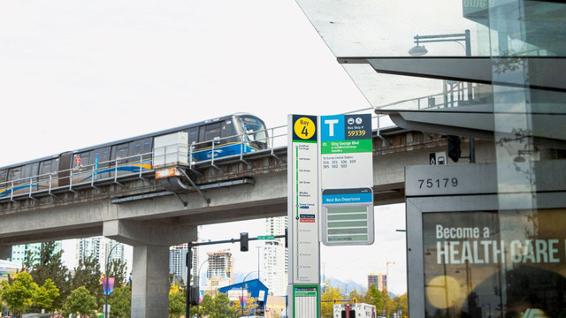 A SkyTrain enters an overhead station. There is a bus stop in front of the elevated track 