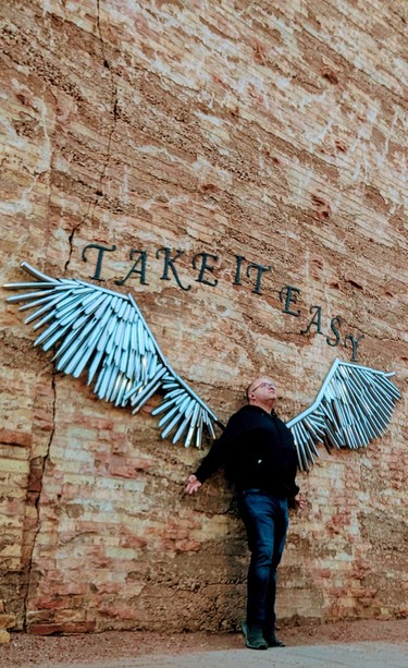 Myself with iron angel wings, with the words "Take it easy" on top