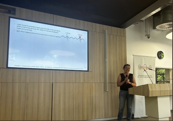 Me giving my talk “Unfolding responses in the global carbon cycle to changing emissions with the large ensemble future projections with interactive carbon cycle “