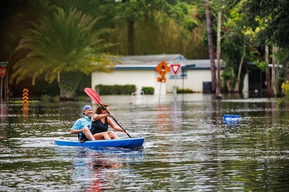 Florida is being slammed by rising sea levels, increased flooding, severe storms and extreme heat.
(Photo: CityofStPete via Flickr)

A couple in a kayak seem to be enjoying the flood