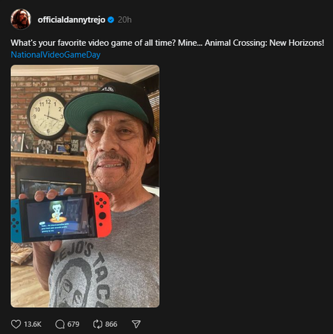 Screenshot from Threads showing Danny Trejo holding on a Nintendo Switch with Animal Crossing: New Horizons playing. He says its his favorite video game of all time!