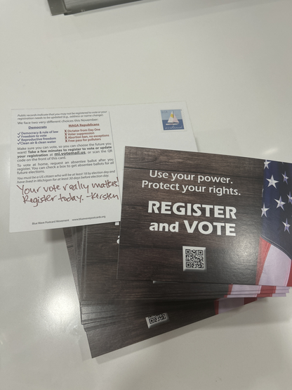 Stack of 100 postcards going to residents in Michigan that may not be registered to vote. Handwritten message for emphasis “your vote really matters. Register today. “
