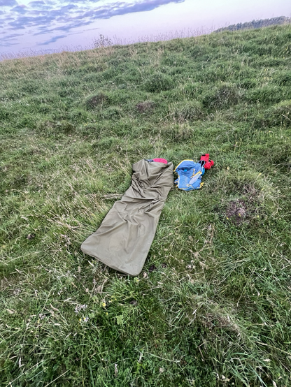 A cheap bivvy bag was my home for the night, laid out in a small hollow formed by a disused pit to the south of Beacon Hill summit. Next to the bivvy is my run bag - an Ultimate Direction Fastpack 30 litre bag