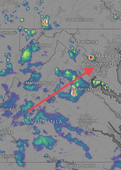 Weather radar shows multiple showers, some with thunder, moving towards and around Washington from the southwest