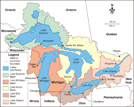 a map outlining the contour of the Great Lakes basin, the area of land that naturally drains into the five Great Lakes of North America. Starting at the 9 o clock position and going clockwise, this includesz the cities of Duluth, Saulte Ste. Marie, Kingston, Ottawa, Rochester, Buffalo, Cleveland, Toledo, Chicago, Milwaukee, and Green Bay. All of Michigan is included.