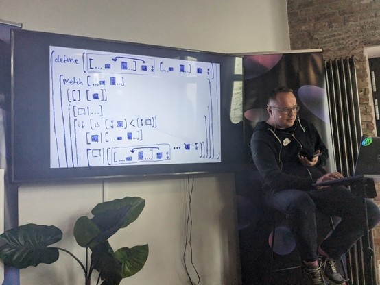 showing a napkin sketch on screen during a talk