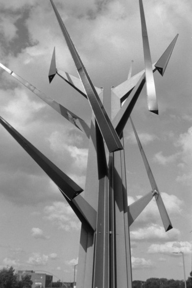 A black and white photograph of a Stockton on Tees sculpture by the river