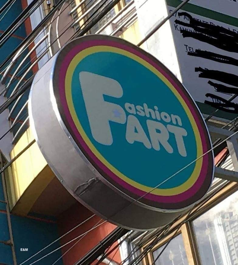 a circular sign that says Fashion Fart, but really wants to say Fashion Art