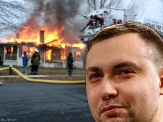 Disaster girl meme; a big fire in background, and a little girl looking over her shoulder at you with a vicious smile; but here, Budanov looks at you (he rarely smiles but i found a pic where the edges of his lips are a teenie wheenie bit raised)