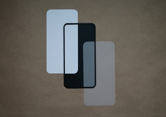 Abstract image of three rectangles of different colors and the same size with rounded corners overlapping each other.