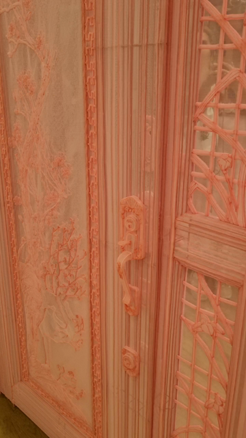 A pink fabric door, see through and very detailed. The locks and handles are all present and correct in 3d, so it's like being inside a Blender scene.