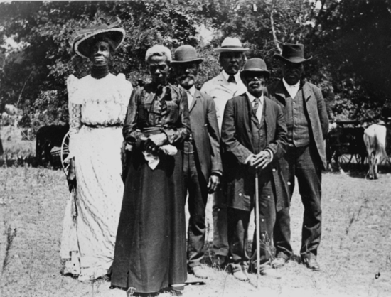 6 former slaves pose at Emancipation Day Celebration, June 19, 1900, photo from the Austin History Center