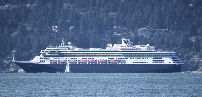 A black and white cruise ship: the hull is black and the upper decks are white. This ship maintains a regular service between Vancouver and Alaska all summer long. Nominally this one of the Holland America ships  - but nearly all the cruise ships are in reality owned by the same company