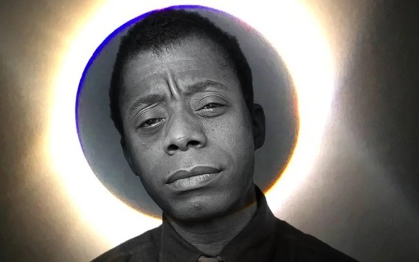 Portrait of the great writer James Baldwin, with a picture of a solar eclipse framing his head. The darkened full moon, and the sun's corona make a halo around James' head.