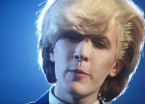 David Sylvian from Japan, with hair glowing in back light.  He's not acutally from Japan.  Just the band.