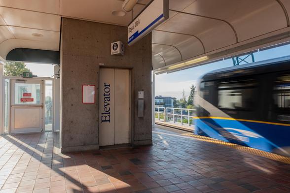 The platform of a SkyTrain station with an elevator 