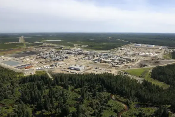 Christina Lake oilsands project in the middle of a large green countryside a complex of oil refinery buildings and equipment  

Cenovus Energy picture
